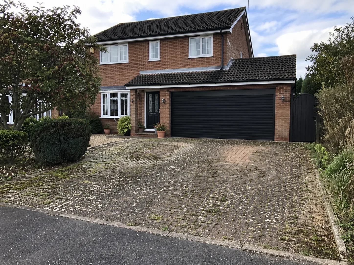 Failing tarmac and cracked asphalt before resin bound